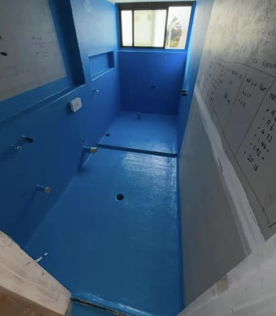 Bathroom fully coated in blue waterproof membrane